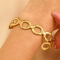 Detail view of retro 18K gold plated stainless steel chain bracelet on a female wrist - Vintage Ring Chain (G-403)