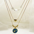Gelaagde gouden kettingset met hartkralen en blauwe zon-en-maan emaille hangers - Blauw