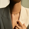 Gold plated evil eye necklace with blue and white enamel charms on model - 18K Gold