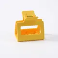 Close-up of bright yellow matte claw clip showing the durable ABS spring mechanism - Bright Yellow