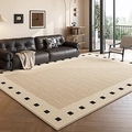 French vintage beige rug with geometric weave and black checkered border in a living room - Persian Velvet - Sydney Riverside