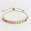 Bracciale dorato regolabile con punti in smalto colorato e zirconi cubici luminosi - Multicolore Puro