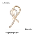 Broche ruban doré avec strass brillants, dimensions 5,2 cm de haut et 2,6 cm de large - Doré
