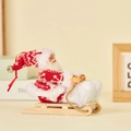 Plush Santa Claus on wooden sleigh ornament with knitted fabric and golden bell details - Sled Style (Red & White Mesh)