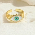 Detail shot of vintage gold evil eye adjustable ring with blue enamel and textured metal - Gold-Green Enamel