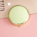 Portable golden round metal makeup mirror in compact folding design with polished finish - 65mm / Gold