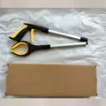 Foldable aluminum trash picker tool with yellow and black grip and storage box - Box Packaging / Yellow