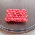 Detailed view of hand-woven pink pearls on an elastic multi-layer beaded bracelet - Pink