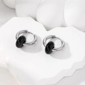 Macro detail of silver stainless steel hoop earring with a polished black natural stone bead - Black Natural Stone