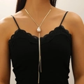 Close-up of a gold-tone Y-shaped lariat necklace featuring a white baroque pearl pendant - Gold Pearl Y-Necklace (9633)