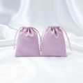 Lavender purple satin drawstring jewelry pouch set with smooth silk texture background - Purple
