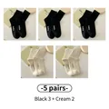 5-pack of cotton crew socks in 3 black and 2 cream colors with hello print - 5 Pairs - 3 Black + 2 Cream