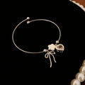 Bracelet argenté avec breloques cœur rose étoile et nœud sur velours noir chic - Style Noeud Étoile Coeur Argent