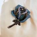Sparkling blue crystal rose brooch with silver alloy finish and rhinestone accents - Blue