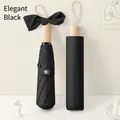Elegante paraguas negro plegable en tres con mango de madera y detalle de lazo decorativo - Estilo de Decoración de Lazo / Negro Elegante
