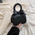 Chic black mini handbag featuring a large bow and decorative silver bead chain - Black