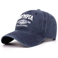Detailed close-up of navy washed cotton cap featuring white OLYMPIA athletic embroidery - Navy Blue