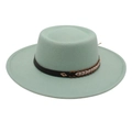 Detailed macro view of mint green flat top felt hat with woven band and gold diamond stud - Mint Green