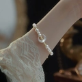 Elegant natural pearl bracelet on wrist with gold beads and a crescent moon pendant - 10# Shell Moon Crescent Pearl Bracelet