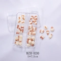 Detailed view of cream resin nail charms featuring bows and bears in a six-grid box - Ice Cream Cone Style (H30)