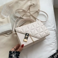 Chic cream quilted crossbody bag with gold chain strap and elegant metal lock detail - Off White