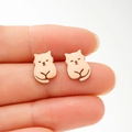 Close-up of cute rose gold cat stud earrings with hollow design for a minimalist style - Rose Gold