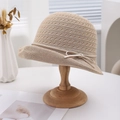 Elegant beige woven sun hat with bow detail and breathable hollow texture for women - Camel