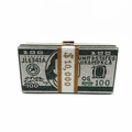 Macro view of crystal-encrusted evening clutch with 100 dollar bill pattern and silver rhinestones - Green