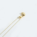 Minimalist gold bean pendant necklace with polished finish and delicate gold chain - Letter L