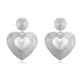 Detail of silver heart drop earrings featuring concentric ridges and polished center - Style G: Silver 1 Pair