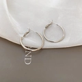 Close-up of minimalist silver hoop earrings on elegant silk background fabric - 2.5cm / Silver