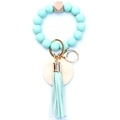 Close-up of mint green silicone beads and natural wood bead on keychain with tassel - Mint Green