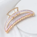 Detail of pink marble acetate moon hair claw clip with golden metal frame on silk - Purple Pink