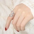 Intertwined crossover open ring in silver finish with textured and polished bands - US 7 / Steel