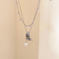 Detail of a layered butterfly necklace with teardrop pearl and clear crystals - Butterfly Pearl Double Layer Style (12#) / Silver-Blue