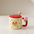 Ceramic tulip pattern mug in cream white with a red lid and flower handle decoration - With Lid and Spoon / Red