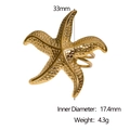 Vista detallada que muestra dimensiones y peso del anillo de estrella de mar dorada de 33mm - Forma de estrella de mar / Dorado