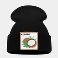 Close-up of the black knit beanie featuring a coconut embroidery patch and text detail - Coconut Pattern