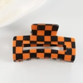 Fashionable orange and black checkerboard hair claw clip with a glossy finish - Orange Black Checkerboard