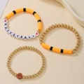 Détail d'un ensemble de bracelets de basket en argile polymère avec perles lettres - Thème Basketball - Orange/Noir/Or