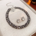 Close-up of vintage luxury silver necklace and square stud earring set with rhinestones - Silver Black