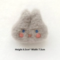 Macro view of grey plush bunny pin with embroidered face and 6.5cm height dimension - Grey Rabbit