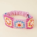 Detailed close-up of handmade boho crochet floral headband with colorful sun pattern - Retro Sun Flower / Pink (Orange Yellow Sunflower)
