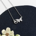 Silver stainless steel necklace featuring a hollow butterfly and heart pendant design - Silver O