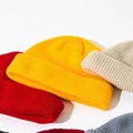Short knit beanie hat in yellow, red, beige and grey colors with fine ribbed texture - Yellow