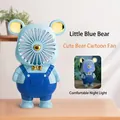 Blue bear cartoon mini fan with night light and USB charging feature on wooden desk - Light Blue