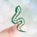 Sparkling dark green rhinestone snake brooch with AB crystal accents in silver finish - Peacock Green