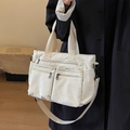 Off-white corduroy tote bag with three front zip pockets and adjustable strap - Off White