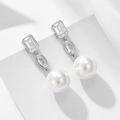 Elegant S925 silver earrings with square zircon and large white pearls on a white podium - 925 Silver / White