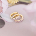 Macro shot of gold-plated hoop earrings with purple zircon stones on pink background - 7# Light Purple